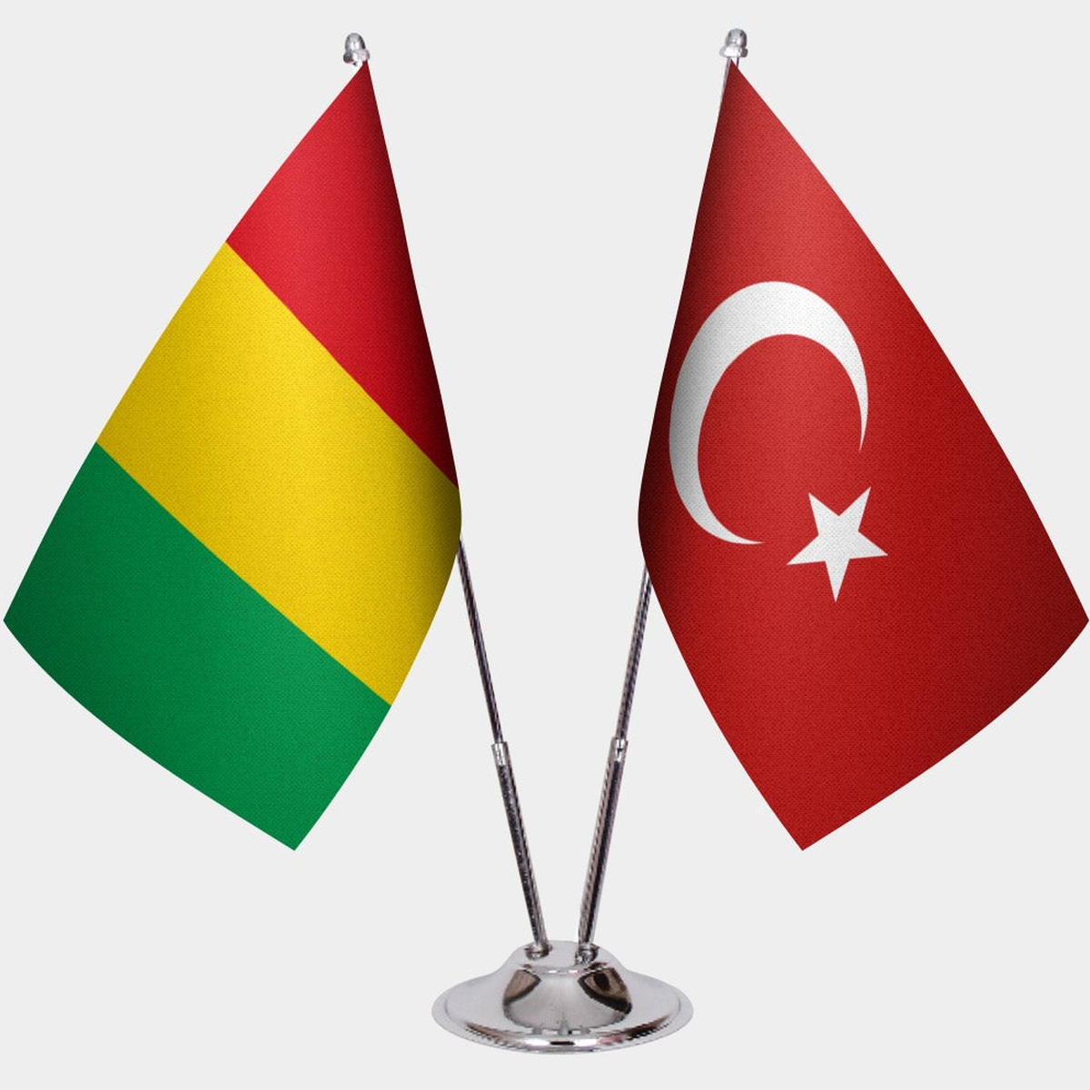 Guinea and Türkiye dual desk flag set with chrome silver pedestal, satin office table flag