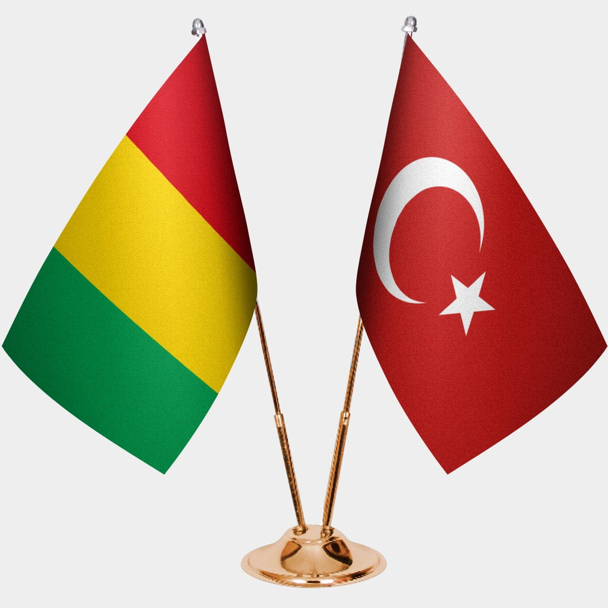 Guinea and Türkiye dual desk flag set with gold pedestal, satin office table flag