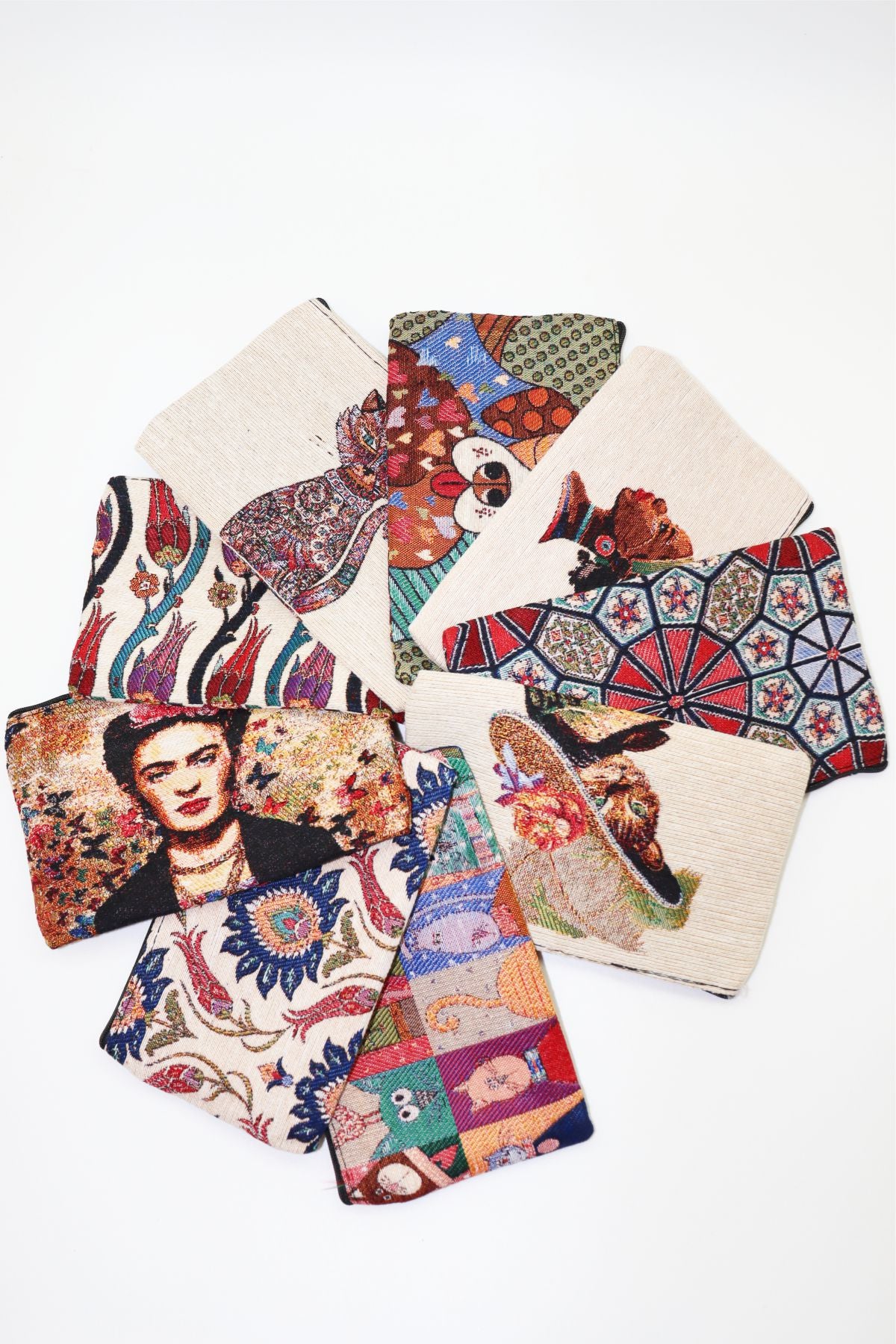 Woven clutch wallets in several motifs, laid out together