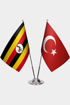 Uganda and Türkiye dual desk flag set with chrome silver pedestal, satin office table flag