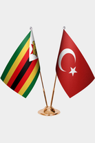 Zimbabwe and Türkiye dual desk flag set with gold pedestal, satin office table flag