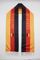 Germany Flag Satin Soccer Scarf laid flat, full length with GERMANY lettering and white fringes